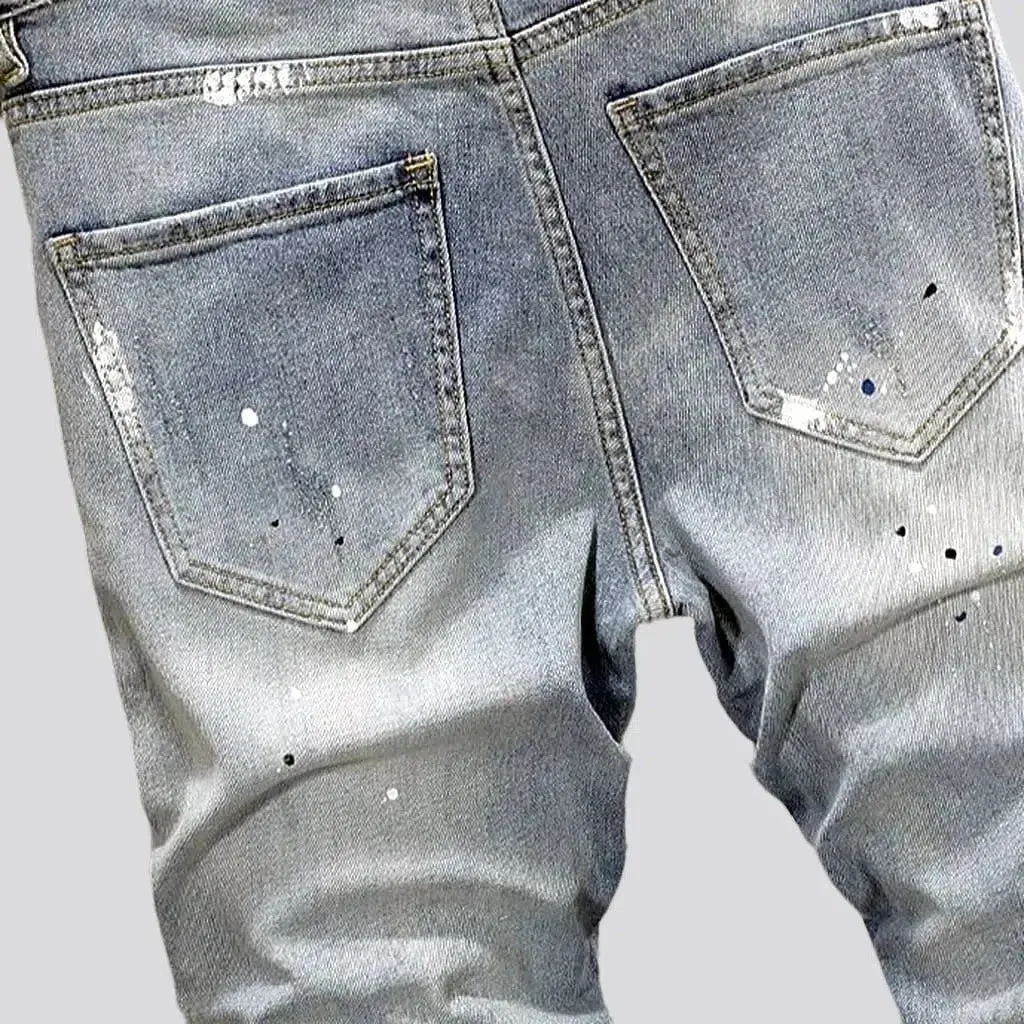 Ripped light men's wash jeans