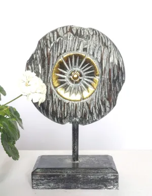 Table Decoration.
Decorative hand carved wooden floral disc on stand.